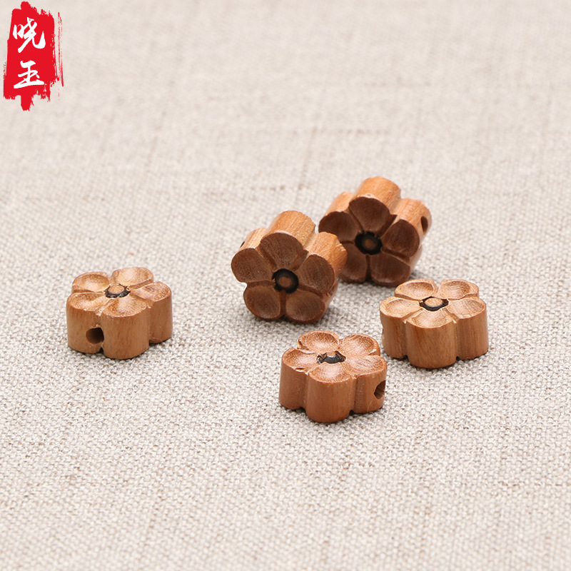 Peach wood carved five-petal plum flower four-leaf clover boxwood plum flower jewelry braided bracelet pendant