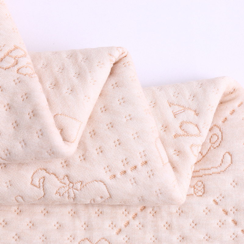 in stock moisture-wicking color cotton urine insulation pad fabric cartoon jacquard air layer quilted composite baby fabric