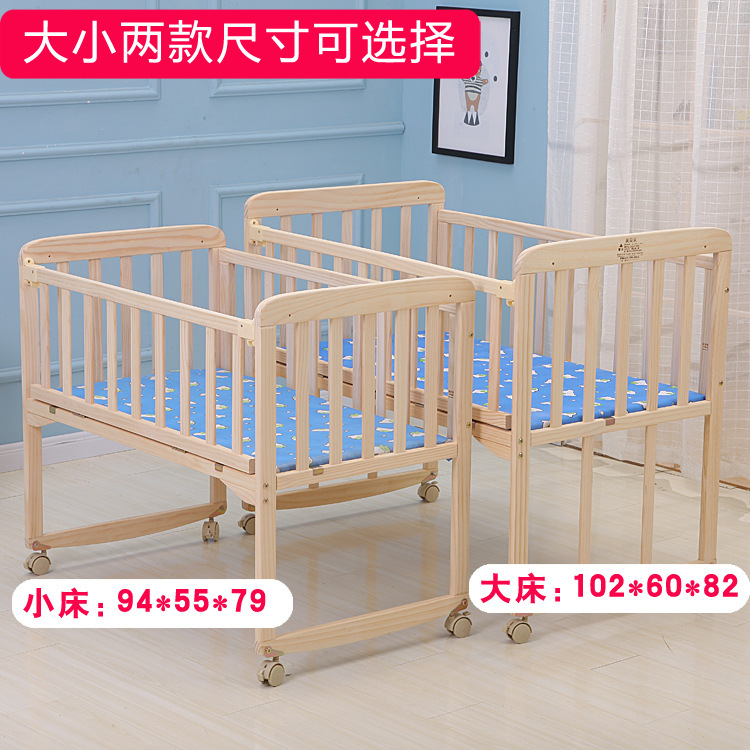 Factory direct selling baby bed solid wood lacquer-free multifunctional Cradle Bed with rollers can be spliced big bed a generation of hair