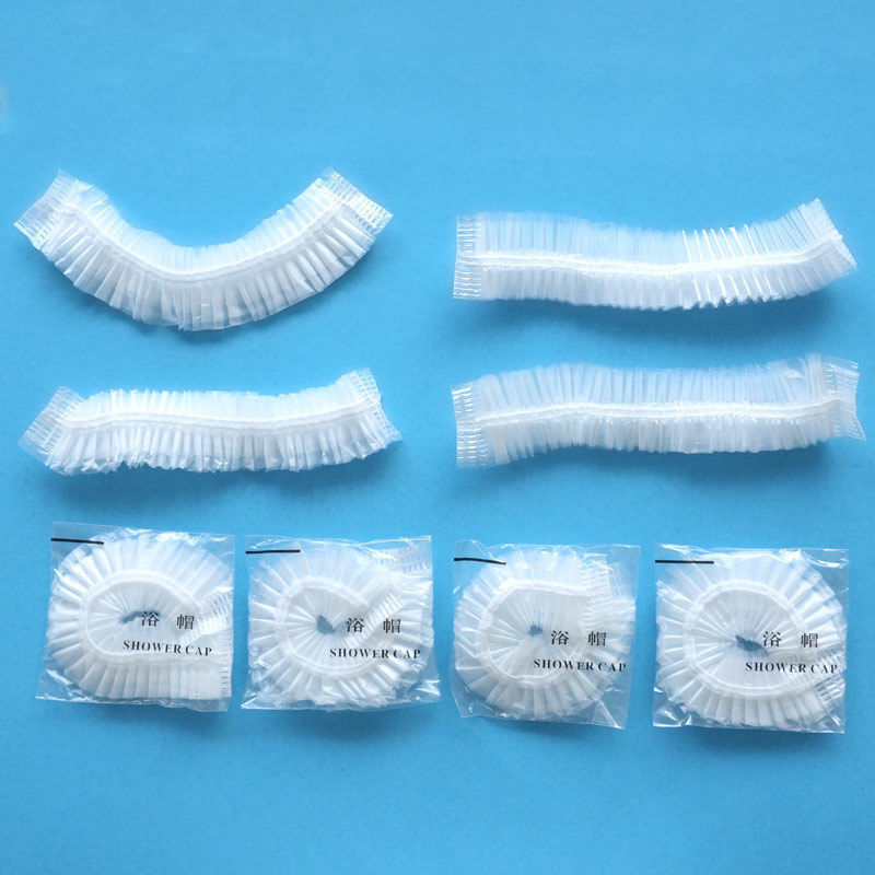 Disposable shower cap strip plastic waterproof enlarged thick hairdressing Hotel Hotel pe independent packaging shower cap high pressure
