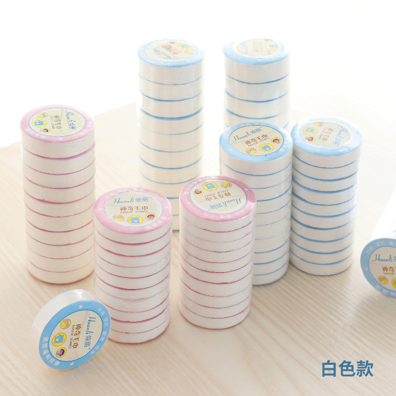 Hotel travel disposable compressed towel pure white absorbent portable non-woven face cleaning towel factory direct supply