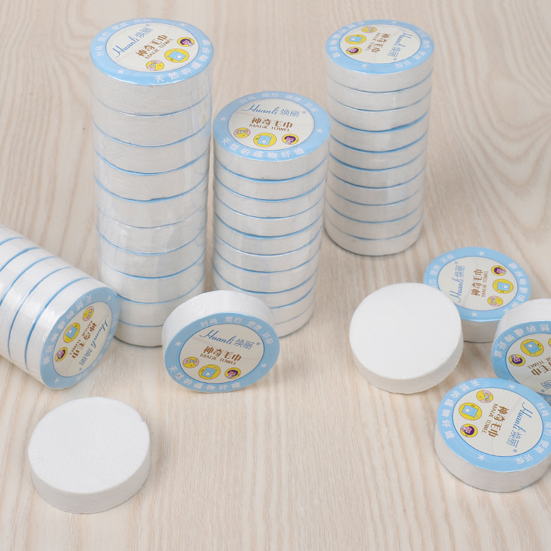 Hotel travel disposable compressed towel pure white absorbent portable non-woven face cleaning towel factory direct supply