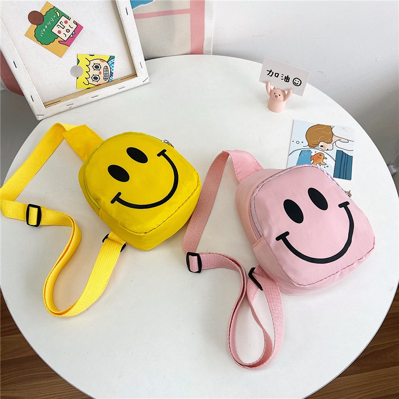 Factory children's smiling face chest bag baby shoulder bag kindergarten small satchel boys and girls sports outdoor waist bag wholesale