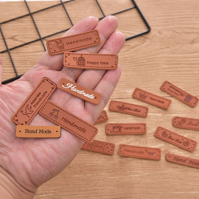 Wholesale PU leather label color-changing leather clothing accessories woven label logo handmade leather brand printing manufacturers