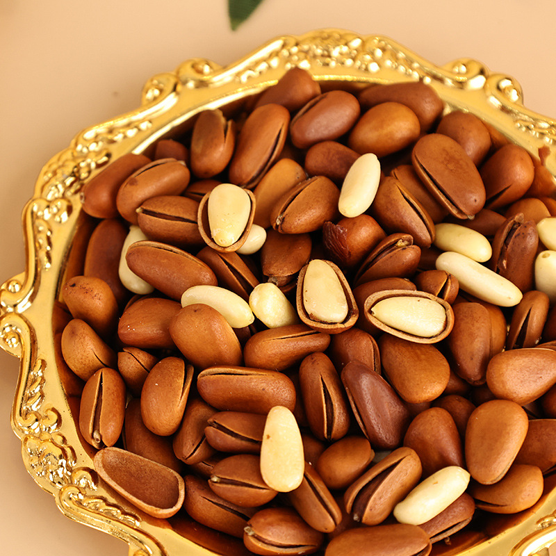 Large grain pine nuts fried open pine nuts children's leisure nuts snacks hand peeled pine nuts manufacturers wholesale