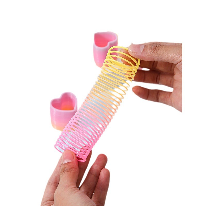 Factory Direct Sales small size magic rainbow circle student educational toys mini shaped spring ring night market stall supply