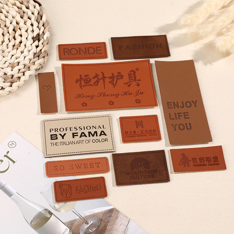 Factory direct wholesale PU leather color-changing leather clothing accessories woven jeans trademark leather printing