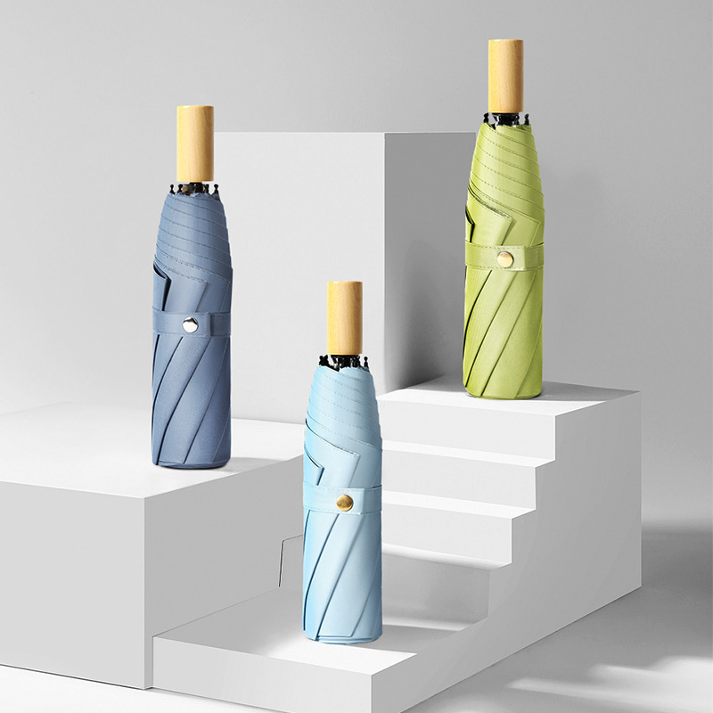 Three folding black plastic solid wood handle student female sun umbrella small fresh fashion sun umbrella simple high-looking umbrella