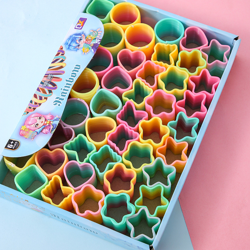 Factory Direct Sales small size magic rainbow circle student educational toys mini shaped spring ring night market stall supply