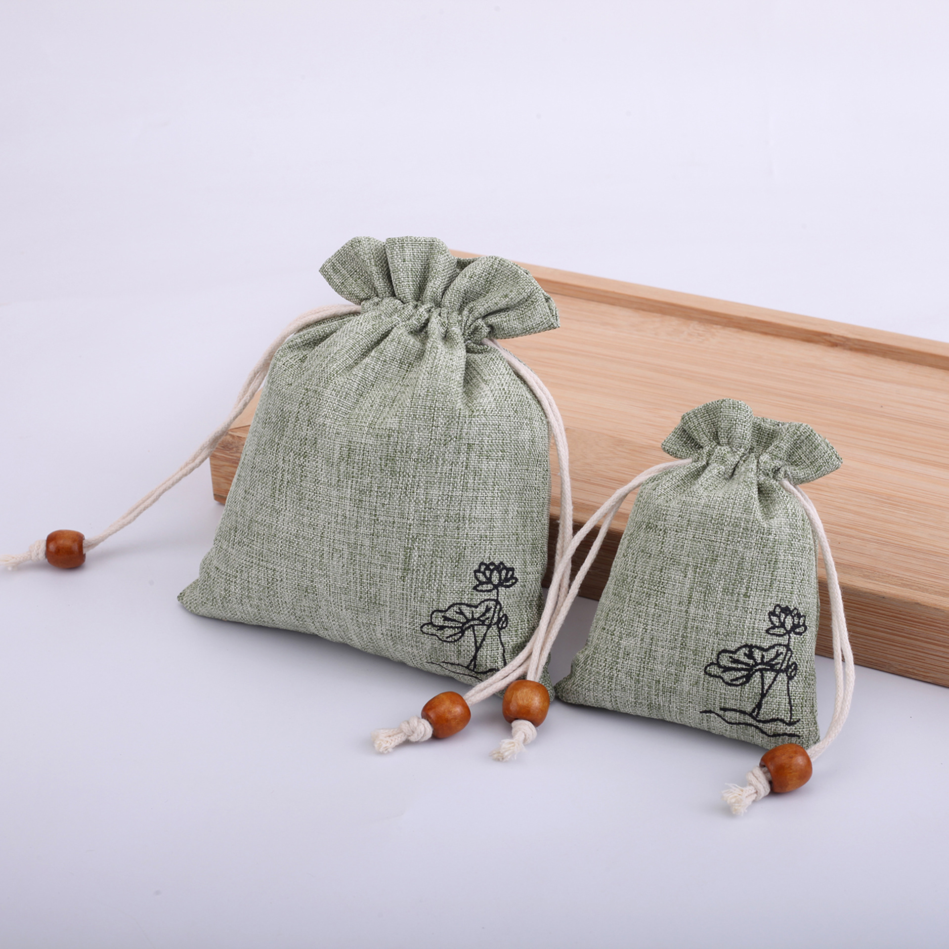 Factory direct supply linen bag text play beads bracelet jewelry packaging bag Lotus linen bag can be fixed LOGO