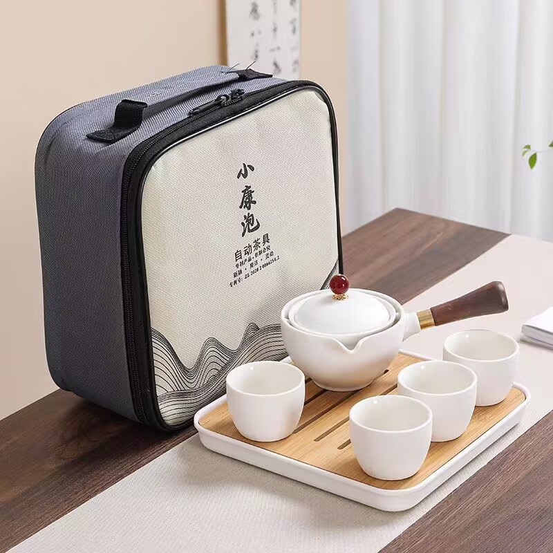 Portable Travel tea set suit sets of ceramic kung fu automatic rotating one pot four cups side handle pot tea maker