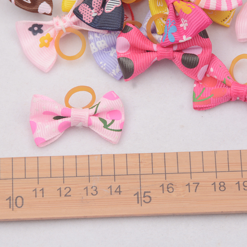 Cross-border pet dog headdress bow cat pet headdress rubber band accessories in stock multi-style mixed hair