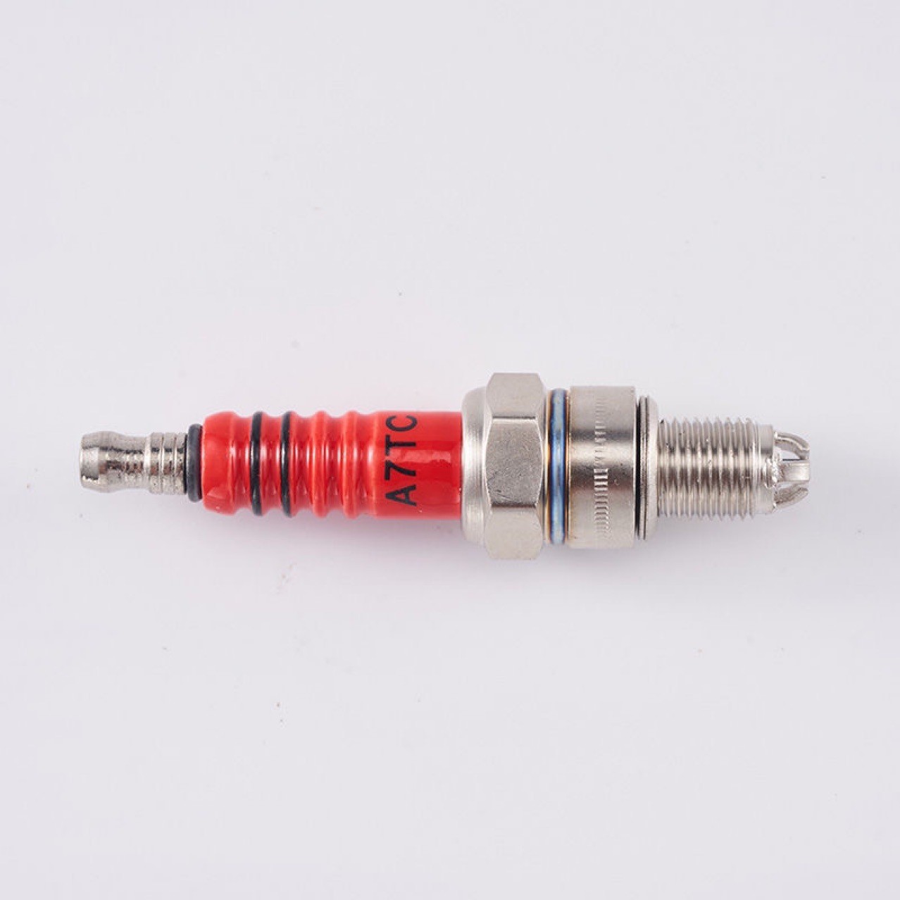 Red porcelain three-pole spark plug D8TC125 motorcycle spark plug three-claw A7TC scooter upgraded version of the fire nozzle