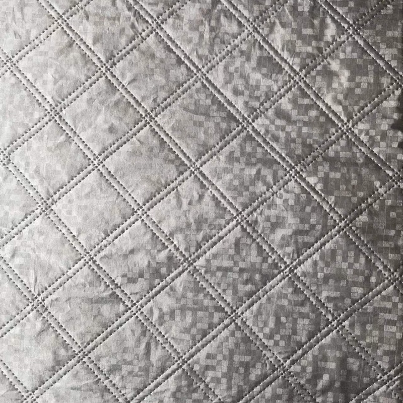 In stock snow shield fabric aluminum film car clothing fabric ultrasonic composite non-woven three-in-one embossed embossed cotton fabric