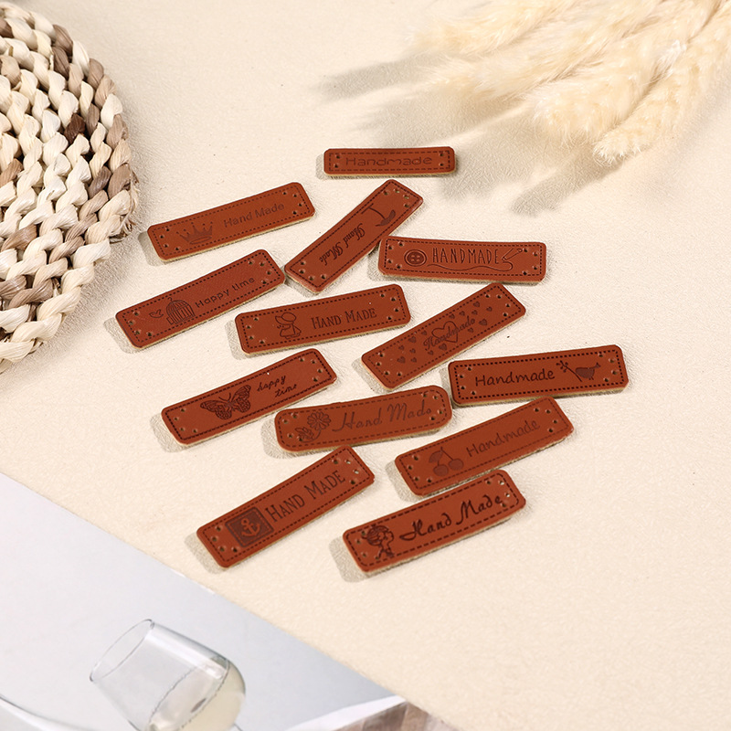 Factory direct wholesale PU leather color-changing leather clothing accessories woven jeans trademark leather printing