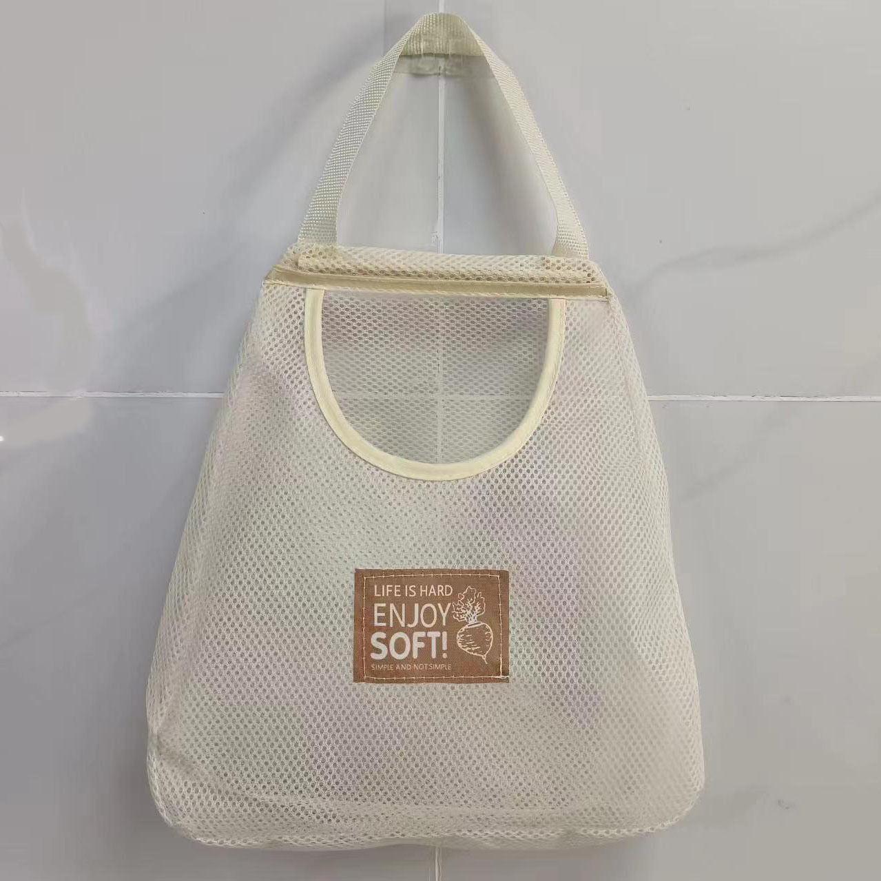 Home wall-mounted creamy-white storage hanging bag for ginger, garlic and onion hollow breathable storage bag wholesale
