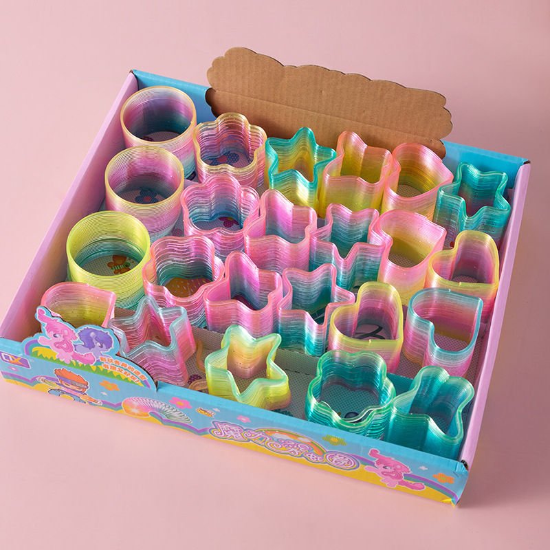 Heart-shaped magic rainbow ring plastic spring ring rainbow stacking music classic educational children's toy stall wholesale