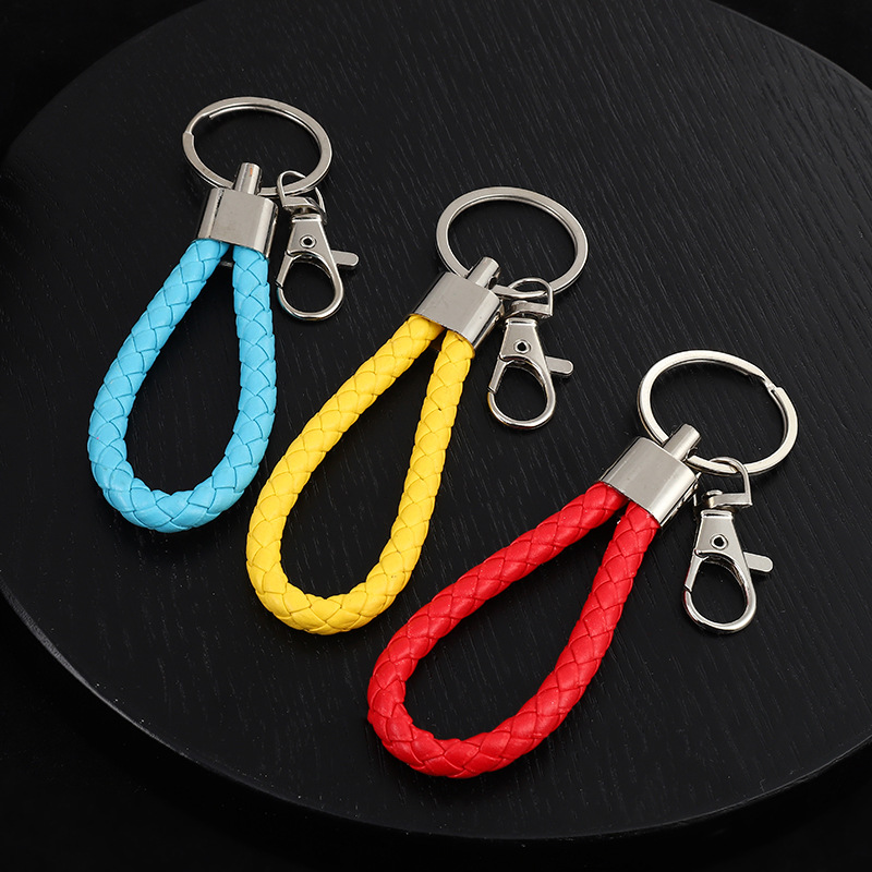Spot wholesale woven leather rope keychain men's and women's DIY handmade car key accessories metal ring pendant decoration