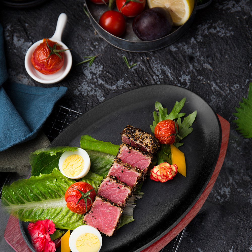 Foreign trade supply manufacturers directly supply cast iron egg-shaped iron plate non-stick baking tray cover rice plate steak striped baking tray waist plate