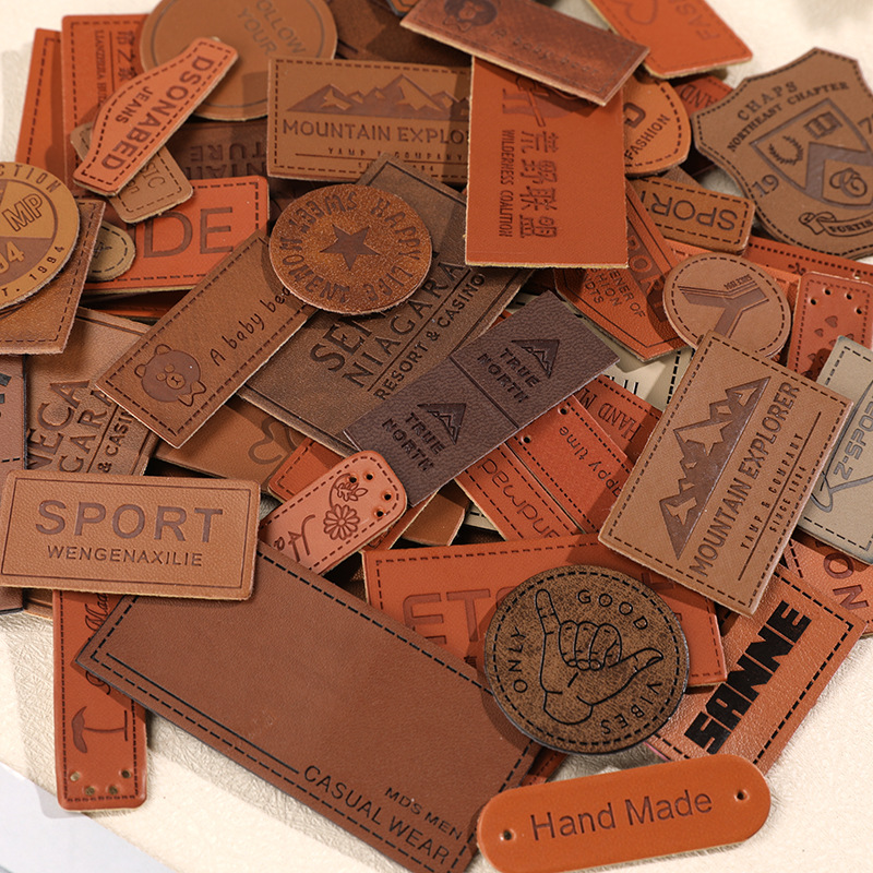 Factory direct wholesale PU leather color-changing leather clothing accessories woven jeans trademark leather printing