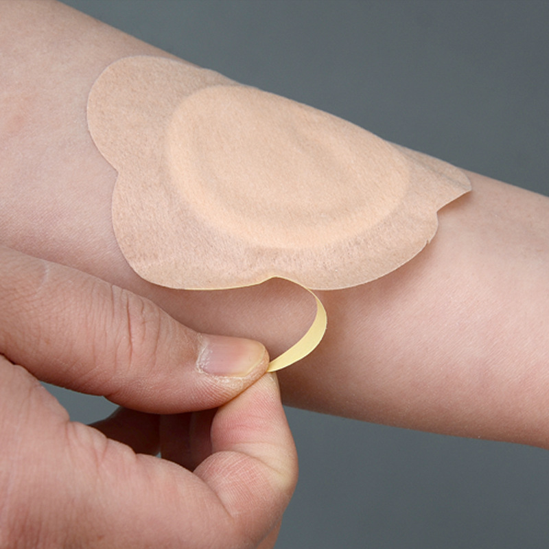 Plum blossom skin color non-woven three-volt patch moxibustion patch breathable dressing patch baby navel patch health care patch manufacturers wholesale