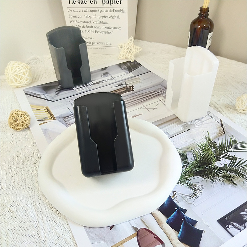 Universal TV fan air conditioner remote control storage box clothes hanger storage wall-mounted desktop mobile phone charging rack