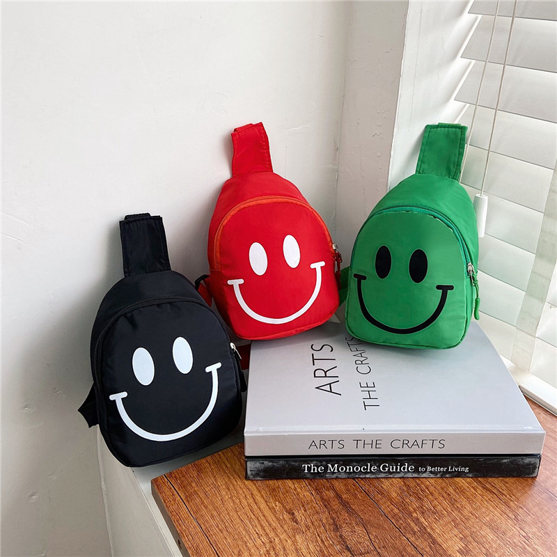 Factory children's smiling face chest bag baby shoulder bag kindergarten small satchel boys and girls sports outdoor waist bag wholesale
