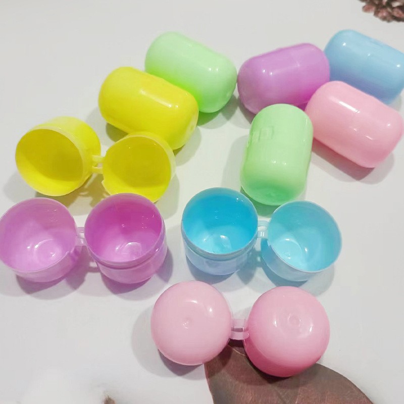 32x 47mm conjoined capsule twisted egg shell oval transparent twisted egg ball one yuan twisted egg machine gift ball blind box wholesale