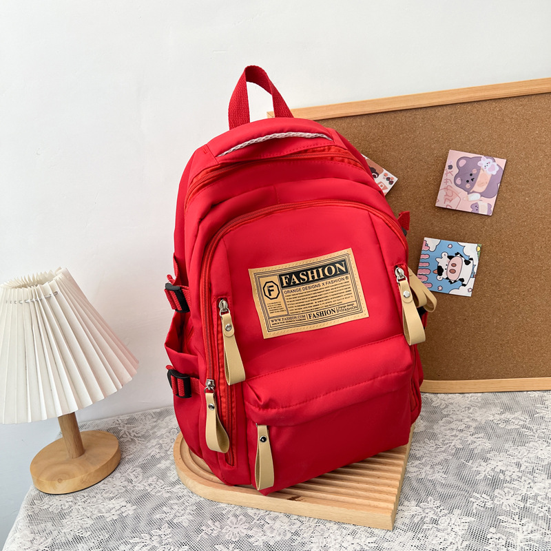 2025 New Cross-Border Schoolbags for Female Students Nylon Retro Simple Junior High School Students Male Large Capacity Schoolbags