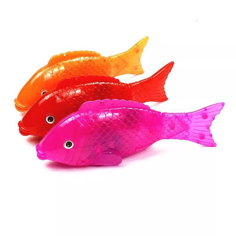 Children's electric fish projection electric solid color fish with light music swing fish stall toys wholesale