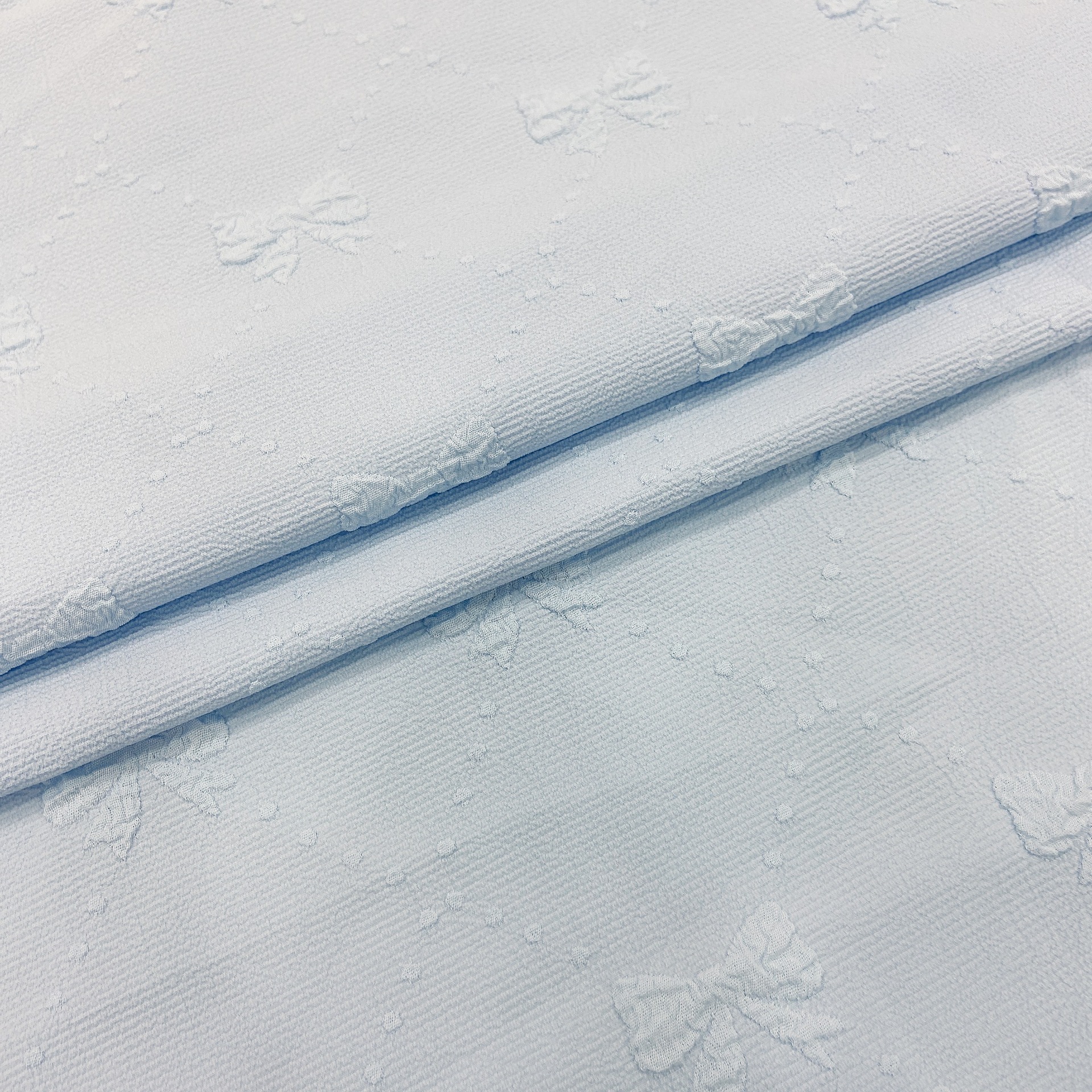 Spot four-sided bubble embossed small Bow Jacquard fashion women's clothing children's dress small top fabric