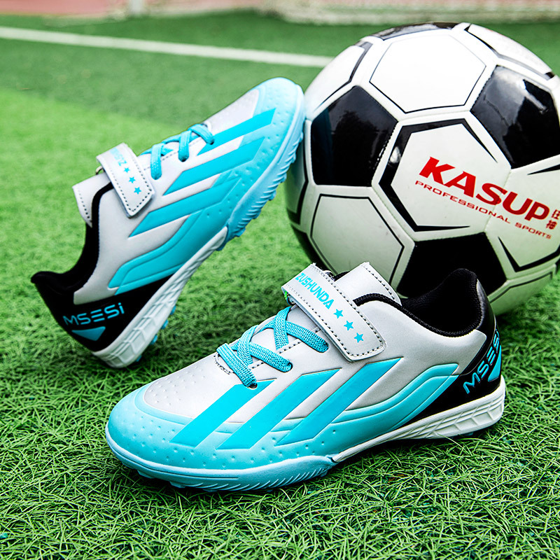 Factory direct selling children's football shoes tf broken nails artificial lawn boys and girls students leather feet students training sneakers