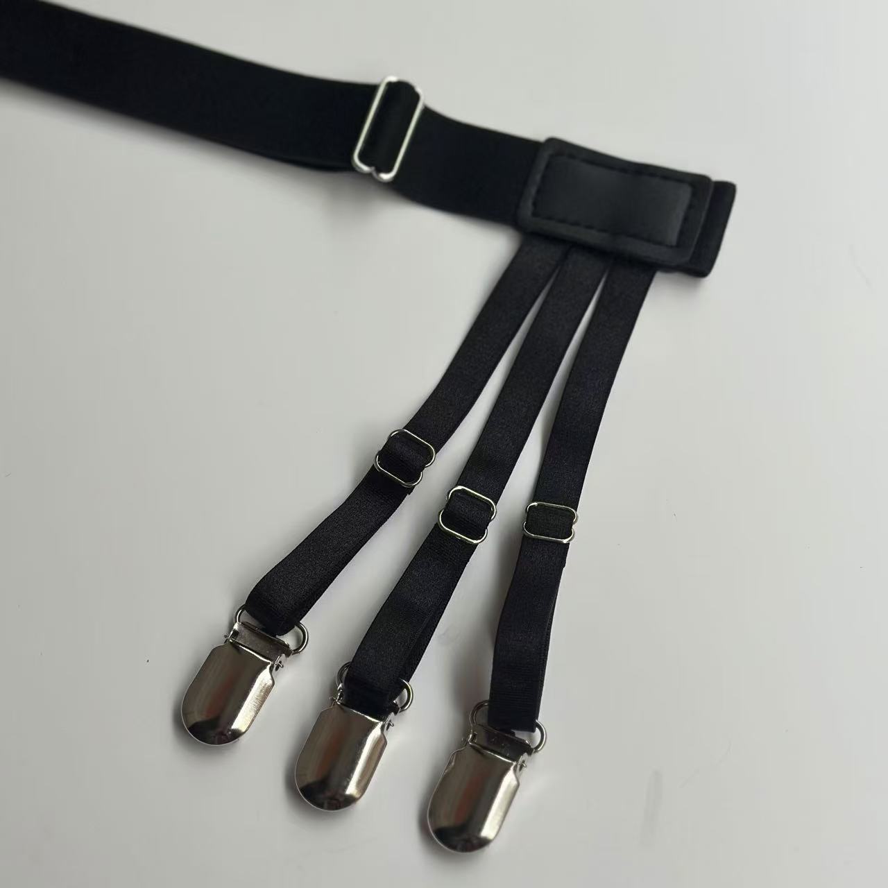 Cross-border source of goods for men and women European and American popular shirt anti-wrinkle anti-slip out shirt clip-leg garter belt