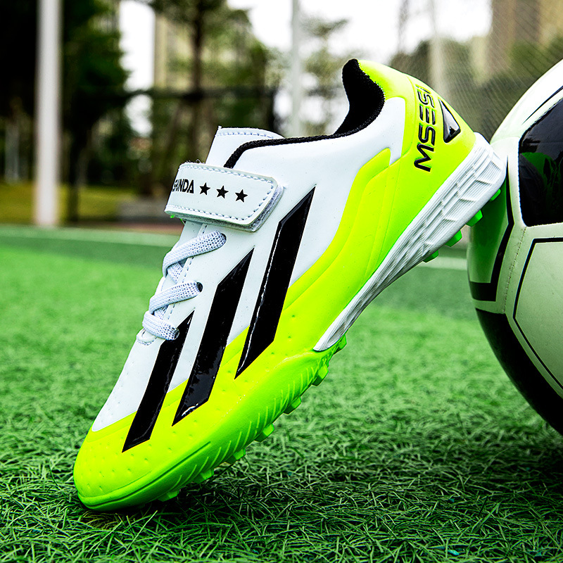 Factory direct selling children's football shoes tf broken nails artificial lawn boys and girls students leather feet students training sneakers