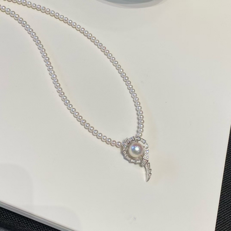 The New Snake Universal Buckle Pendant Is a Perfect Match for Single Wear or Baby. It Is Made of S925 Silver Inlaid Throughout the Body