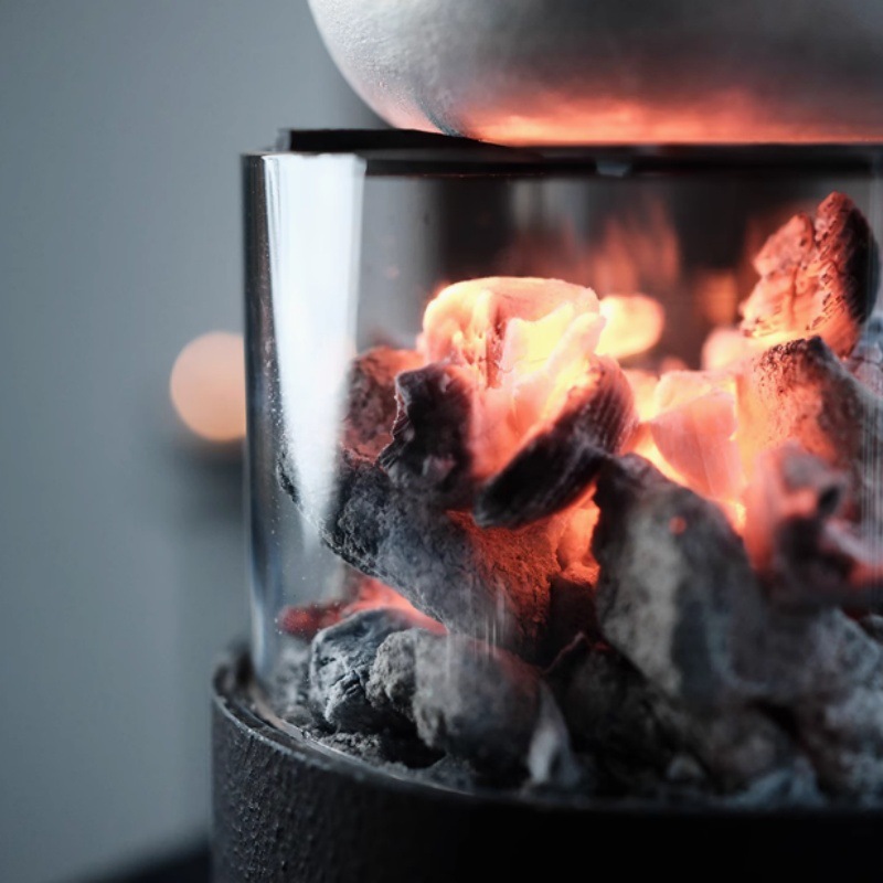 The stove can be watched for cooking tea by surrounding the stove. The fire can be closed. Glass charcoal stove indoor heating stove outdoor camping small tea stove tea maker